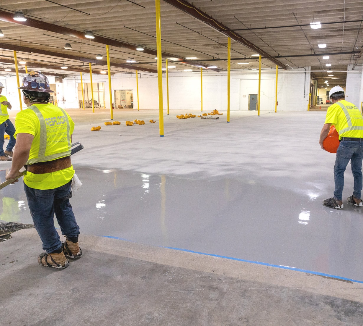 Epoxy resinous flooring installation in warehouse
